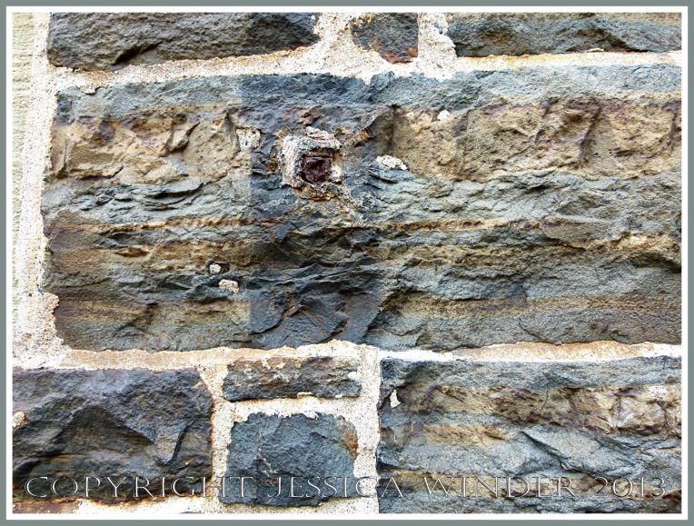 A wall of local meta-sedimentary rocks in one of the Historic Properties on the Halifax waterfront, Nova Scotia, Canada.