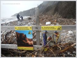 Cliff danger warning signs on a Dorset beach