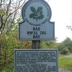 National Trust signpost at Pwll Du Bay