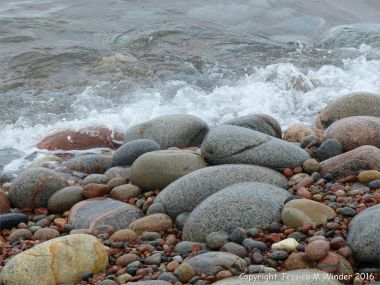 Pebbles at the water's edge at Pleasant Bay in Cape Breton Island