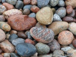 Wet pebbles at the water's edge in Pleasant Bay, Cape Breton Island, NS.