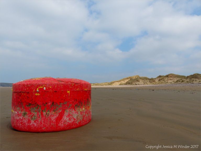 Wrecked mooring buoy on the sand at Rhossili