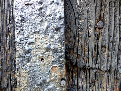 Textures produced by weathering and age on old boathouse woodwork and ironwork