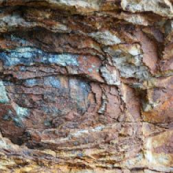Rock colour, pattern and texture in spheroidal weathering: Rock pattern and texture caused by spheroidal weathering in cliffs at Smelt Sands State Park on the Oregon Coast in the U.S.A. as seen from Trail 804 and showing colours of decomposing iron minerals (12)