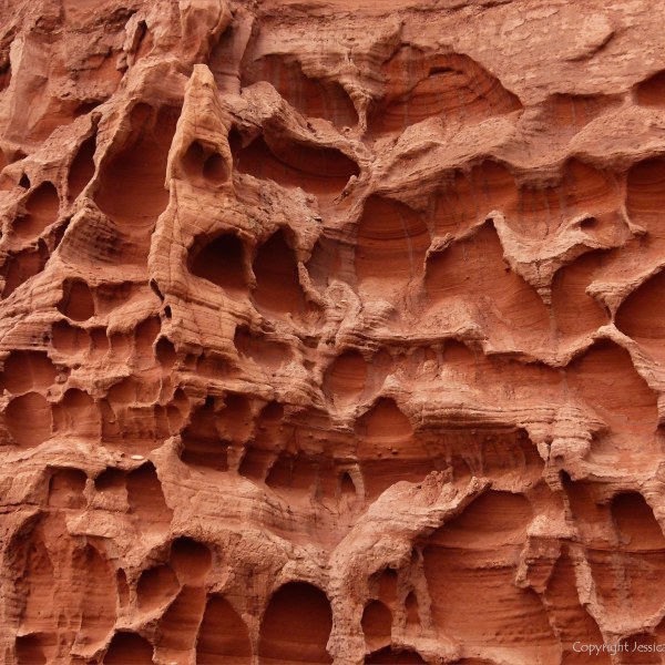 Honeycomb weathering pattern and texture in red rocks